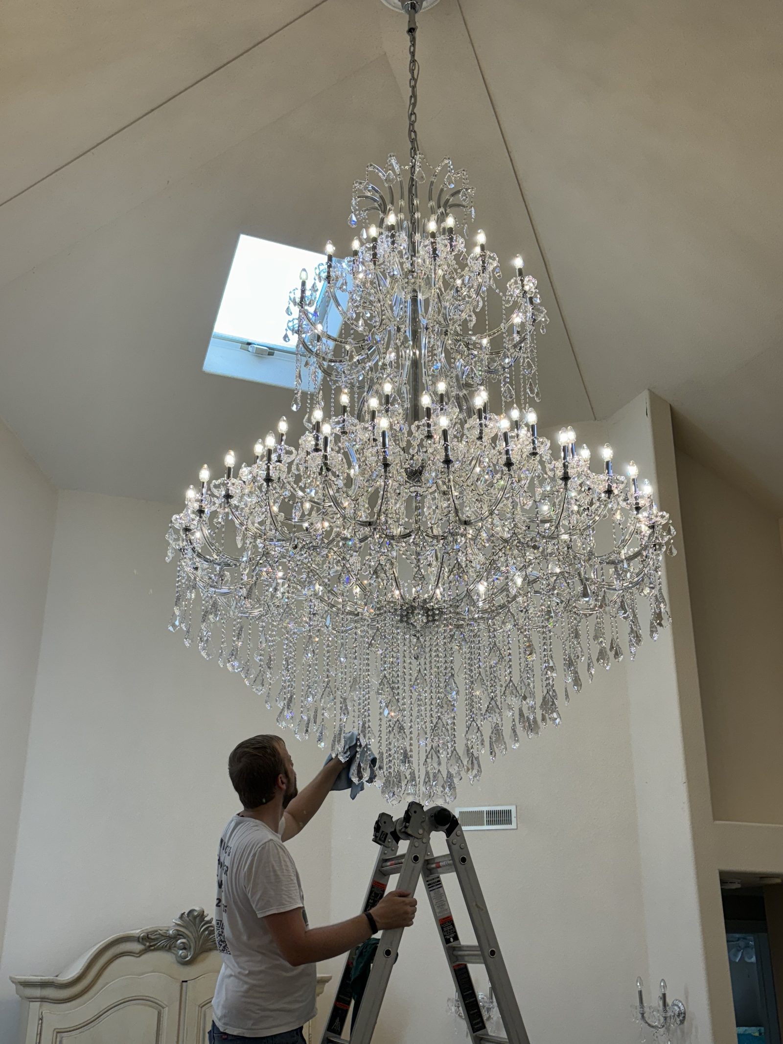 Close-up of Swarovski crystal chandelier — restored sparkling clarity