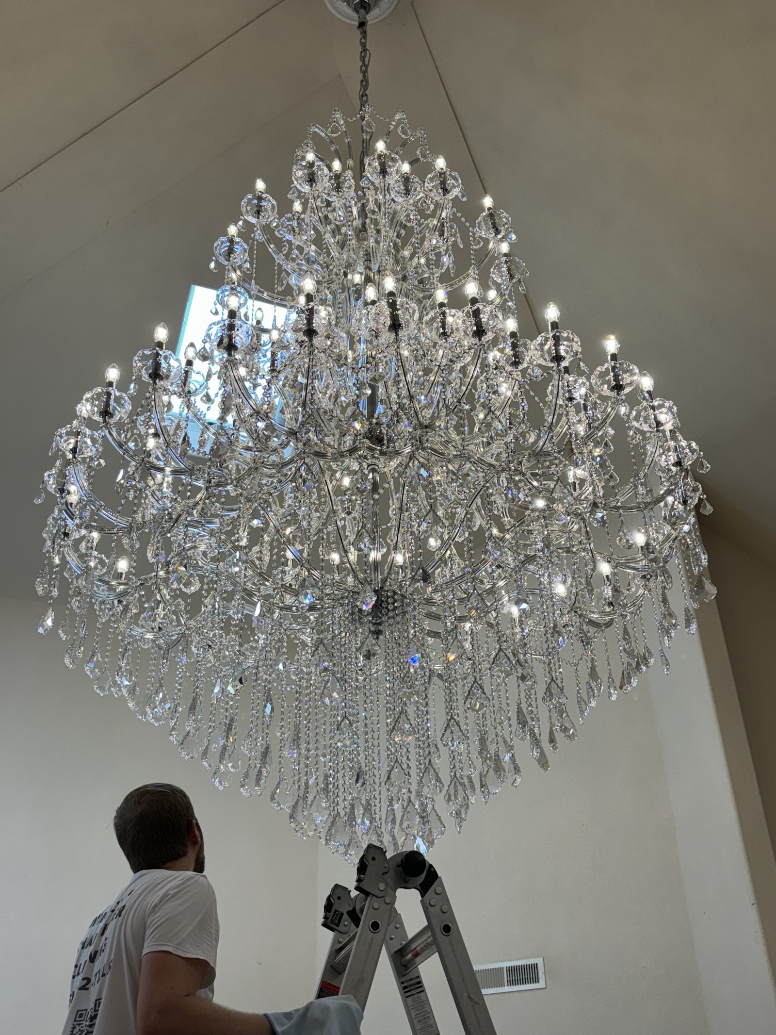 Authentic Swarovski chandelier fully cleaned and sparkling after professional service