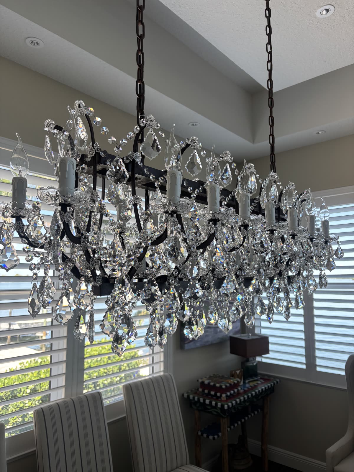 Crystal chandelier with hundreds of prisms — spray cleaning can't reach every surface like hand cleaning can