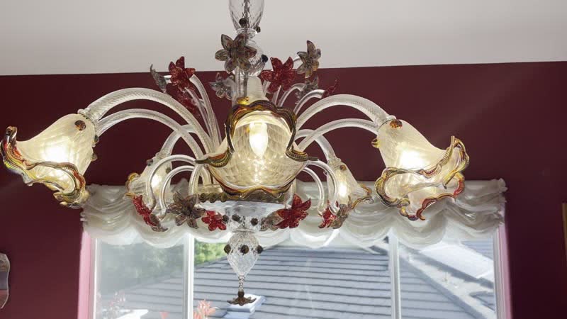 Delicate Murano glass being cleaned with a soft lint-free cloth